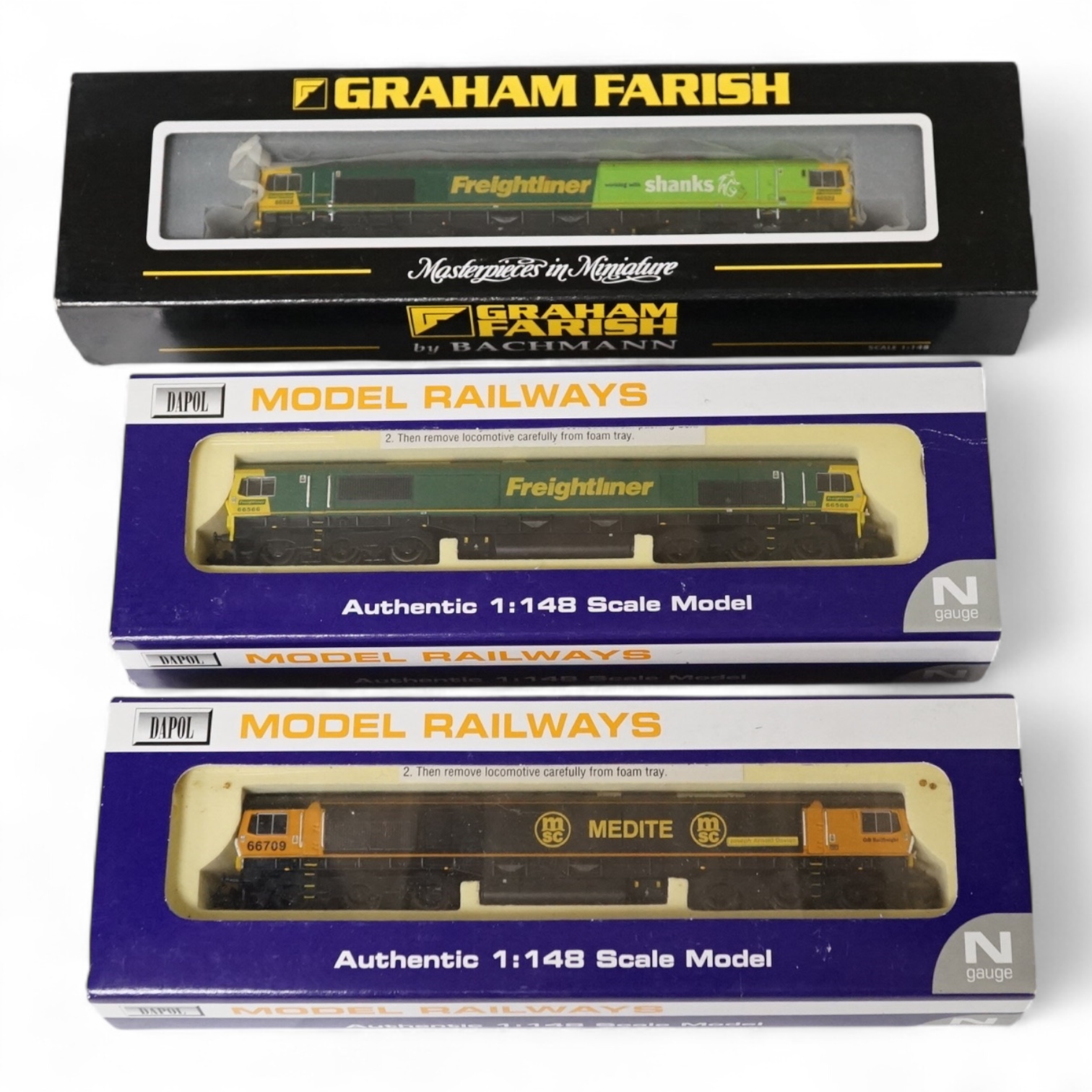 Three boxed Dapol and Graham Farish N gauge railway class 66 diesel-electric locomotives; Freightliner/Shanks 66522 (371-378), Freightliner 66566 (ND-052), and GBRf 66709 (ND-041). Condition - good.